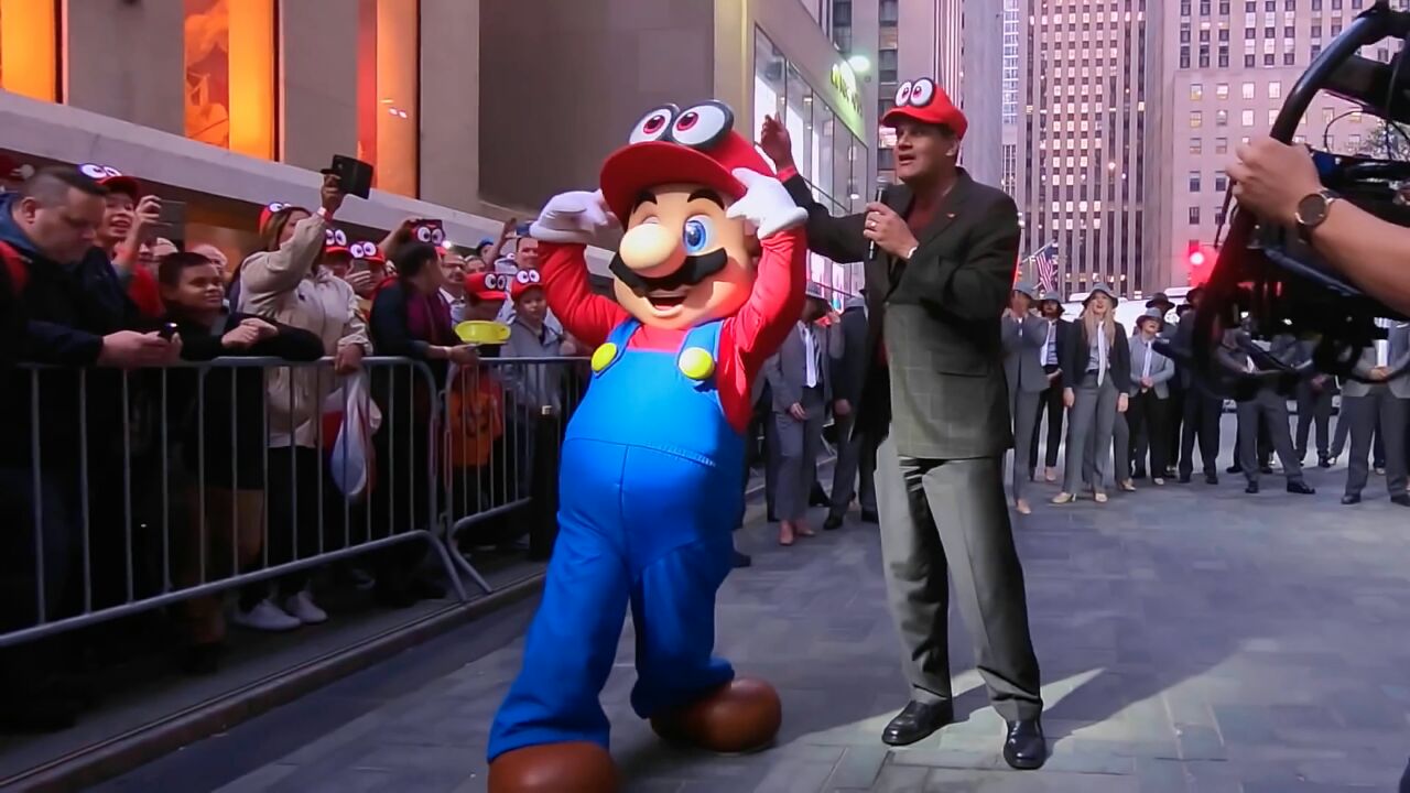 تصویر Reggie Fils-Aimé و Mario